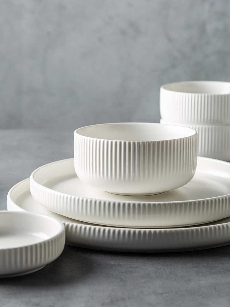 Hualian Yijia Plate Dish Set featuring white ribbed plates and bowls arranged neatly.